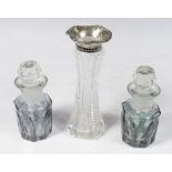 Two blue flashed and cut glass small toiletry bottles and a silver collared vase
