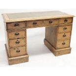 A Victorian pine twin pedestal desk with leather inset top