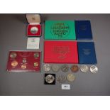 A miscellaneous quantity of coin sets and commemoratives including: Royal Mint issues, Silver 1977