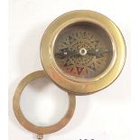 A reproduction brass compass