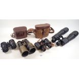 A group of various binoculars, two cased