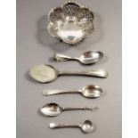 A silver pierced trinket dish, Birmingham 1911 and four silver spoons and a plated spoon -