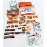 A large quantity of Hornby 'OO' gauge wagons, coaches etc. plus station terminus, mostly boxed