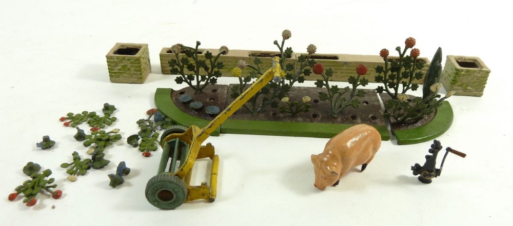 A Britains part garden set and Meccano lawn mower