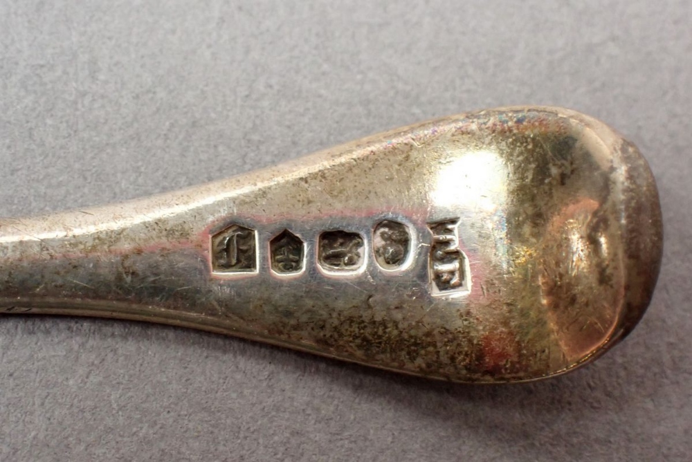 A Georgian silver caddy spoon with bright cut decoration, Birmingham 1829, a silver and mother of - Image 3 of 3