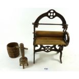 A Victorian cast iron toy mangle (repaired) 23cm tall, and a wooden washing dolly and tub