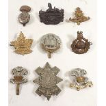 A 9th Battalion Highland Light Infantry cap badge and other cap badges