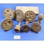 A collection of 19th century wooden butter stamps carved flowers, fruits etc