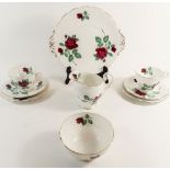 A Royal Standard 'Red Velvet' tea service comprising six cups and saucers, six side plates, cake