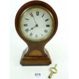 An Edwardian mahogany balloon clock with French movement and key, 19cm