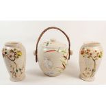 A Kyoto 1930's biscuit barrel and two vases painted flowers and birds