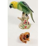 A Beswick parrot and a Pekinese dog