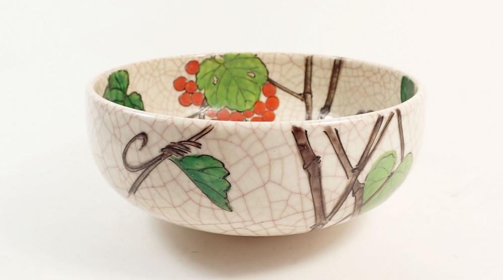 A Kyoto ware 1930's bowl painted vines, 19cm diameter