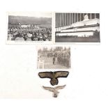A WWII German cloth badge, metal badge, two postcards etc