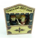 A reproduction painted metal Punch and Judy money box