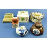 A collection of porcelain inkwells including Quimper one