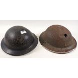 Two WWII Brodie helmets - one with chin strap for Home Guard and one Bakelite helmet (used by