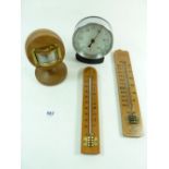A chrome framed thermometer and three others