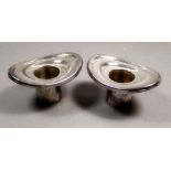 A pair of silver oval candle sconces