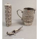 An Indian white metal cream jug, a filigree junk and a cylindrical box