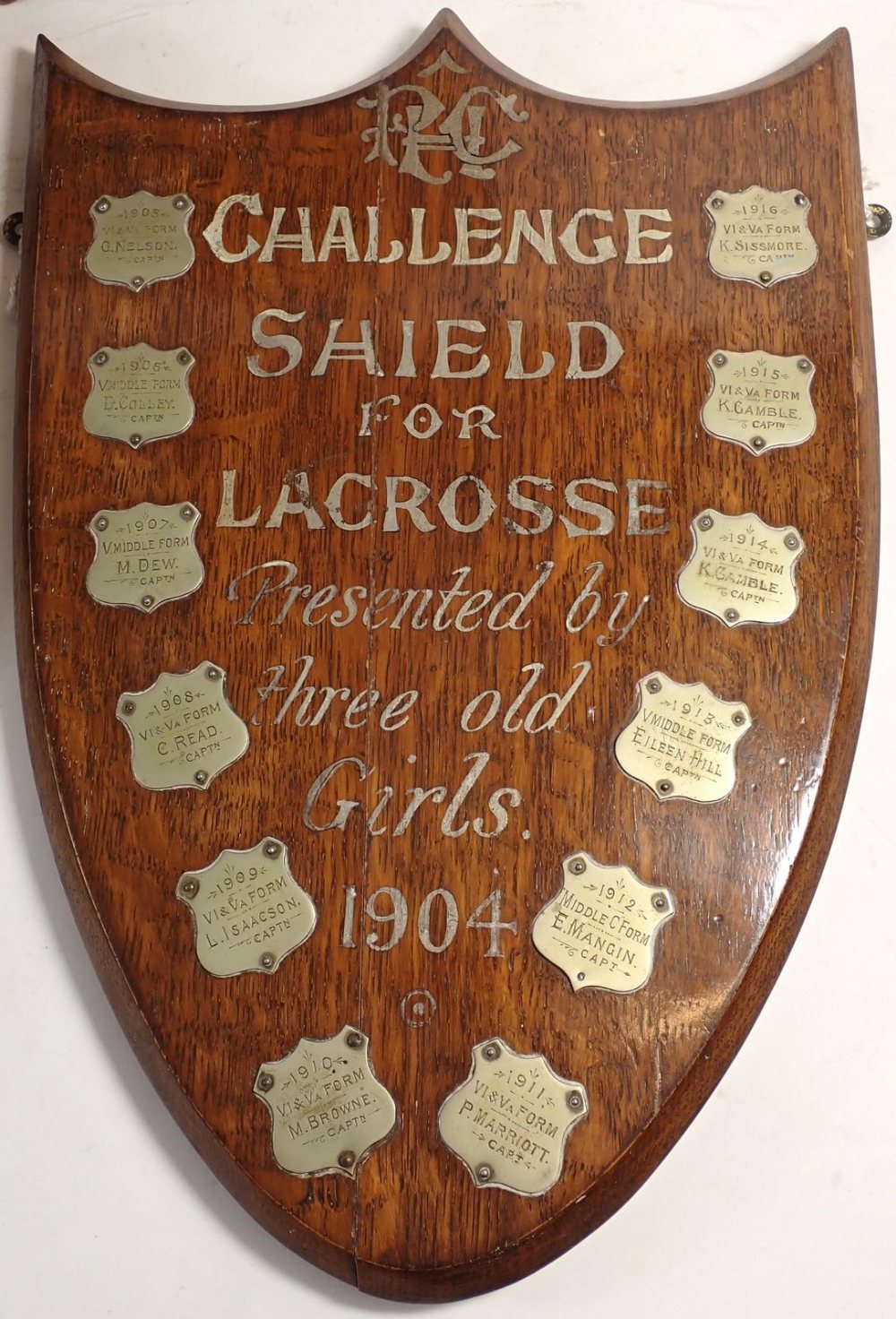 An oak lacrosse shield from Princess Helena College set with silver plaques and two similar, with - Image 4 of 4