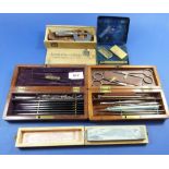 Two early 20th century dissection kits - boxed, plus a safety razor, sharpening stone and micrometer