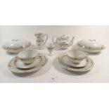 A Bauscher Bros tea service with rose printed borders comprising a teapot, milk, sugar, two egg