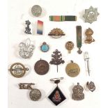 Various sweetheart brooches and military badges