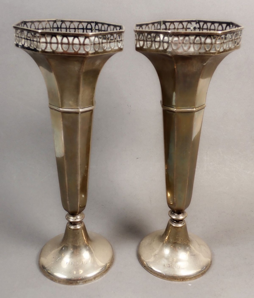 A pair of silver fluted vases with pierced decoration, Birmingham, marks rubbed, weighted, approx