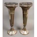 A pair of silver fluted vases with pierced decoration, Birmingham, marks rubbed, weighted, approx