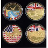 A presentation box containing four D Day enamel, gold plated commemoratives ref 70th anniversary