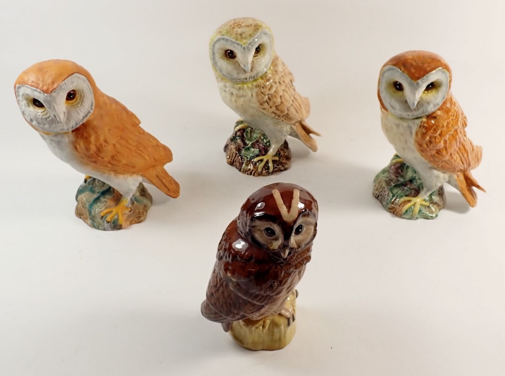 Three Beswick barn owls, one matt and the others glazed, approx 19cm high plus a Royal Doulton Tawny