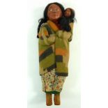 A Skookum Native American doll with baby, 27.5cm high