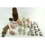 A box of dolls heads, bisque frozen Charlotte dolls etc