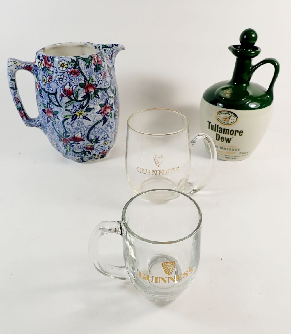 A Ringtons jug, a Tullamore Dew Irish whisky flask and two Guinness tankards