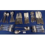 An Elkingtons silver-plated cutlery set comprising six dinner knives and forks, dessert spoons, soup