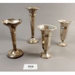 A pair of silver octagonal bud vases, 10cm, Birmingham 1912 and two other silver bud vases