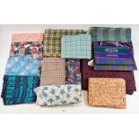 A box of vintage fabrics including tweed