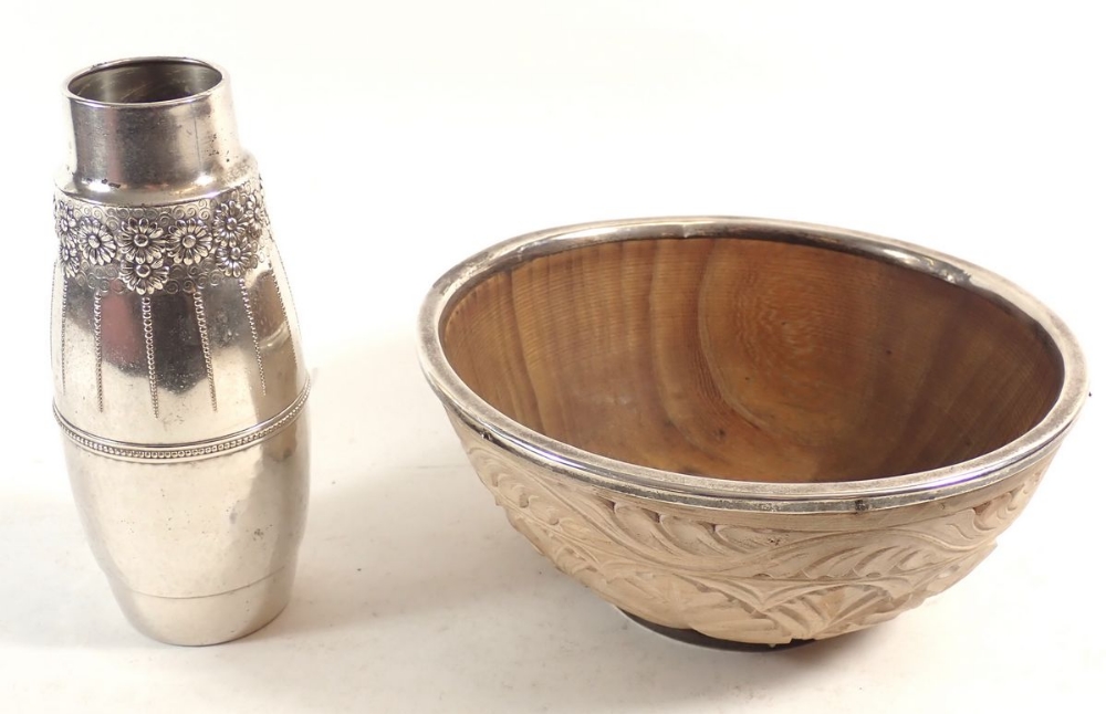 An unusual carved wooden bowl with silver rim, 22.5cm diameter, 1911 London, makers marks Naylor