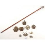 A swagger stick to the London Scottish with regimental badge and various other Scottish cap badges