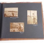 A vintage suede photograph album decorated native American and contents of Paris postcards