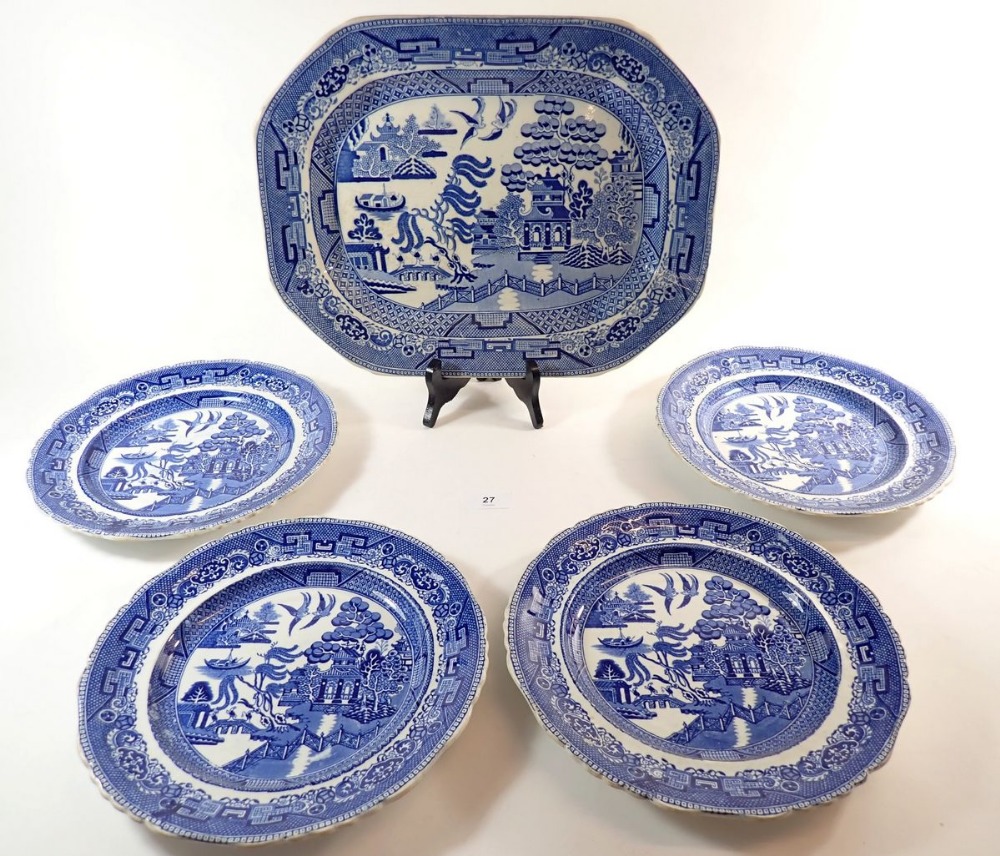 A Victorian blue and white willow pattern meat plate and four dinner plates