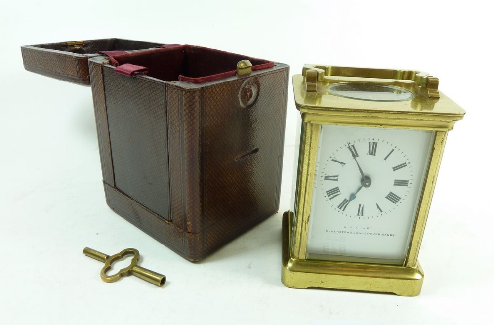 A late 19th century brass carriage clock in leather case