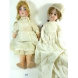 An Armand Marseille bisque headed doll marked 390 and another bisque headed doll a/f