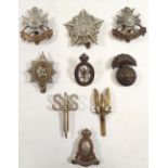 A guards machine gun corps cap badge and various other cap badges