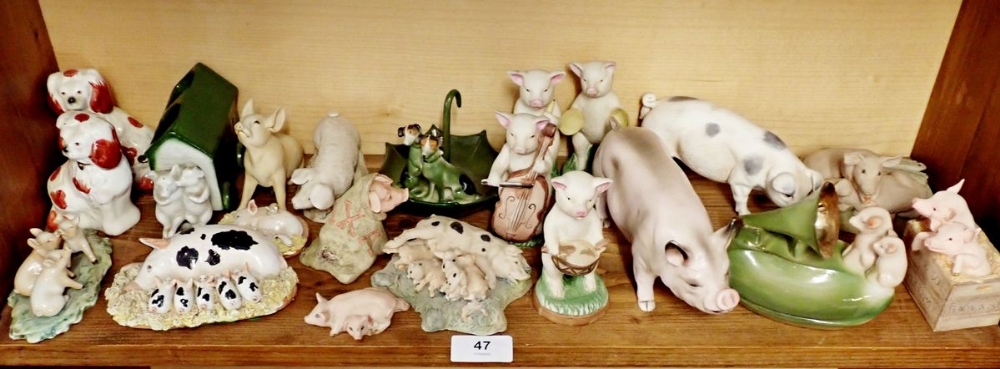 Various pig ornaments including pig band