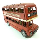 A painted metal London bus, 32cm long