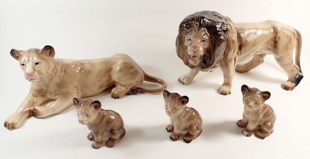 A Melba Ware large size lion family including lion, lioness and three cubs, largest 21cm high