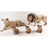 A Melba Ware large size lion family including lion, lioness and three cubs, largest 21cm high