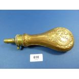 A brass powder flask with embossed decoration, 21.5cm